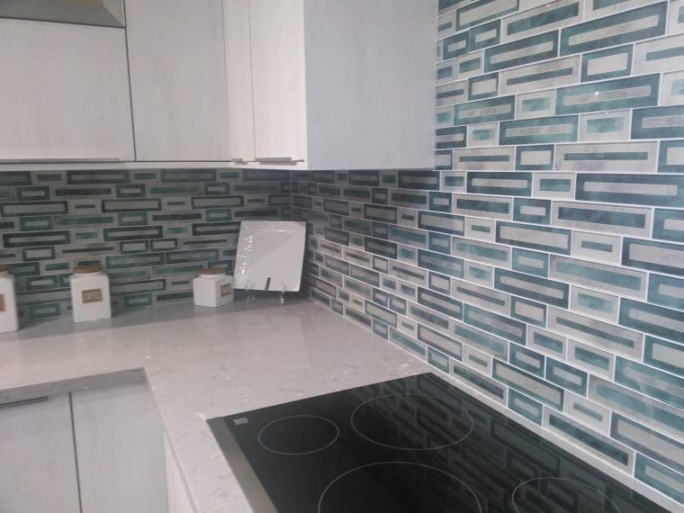 colorful-tile-kitchen-backsplash-white-european-cabinets